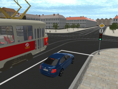 Křižovatka se zelenou a tramvají